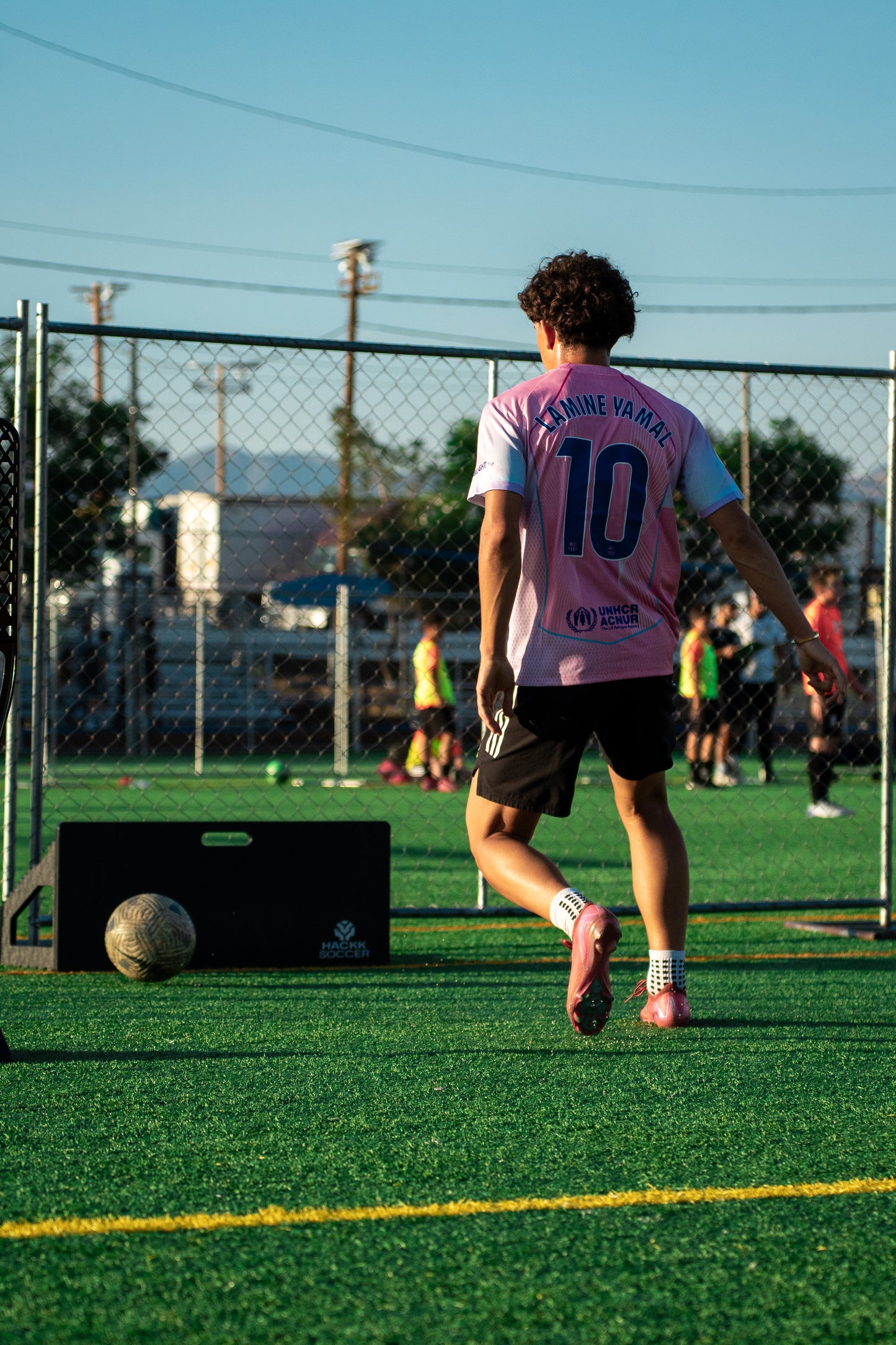Complete soccer training setup with rebounder board in garden