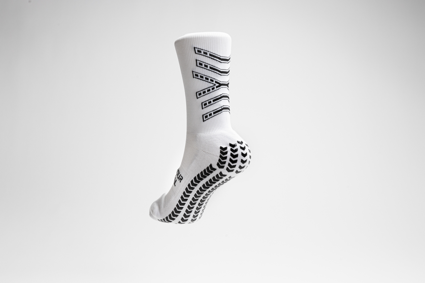 Youth player wearing NanoGrip soccer socks during training session