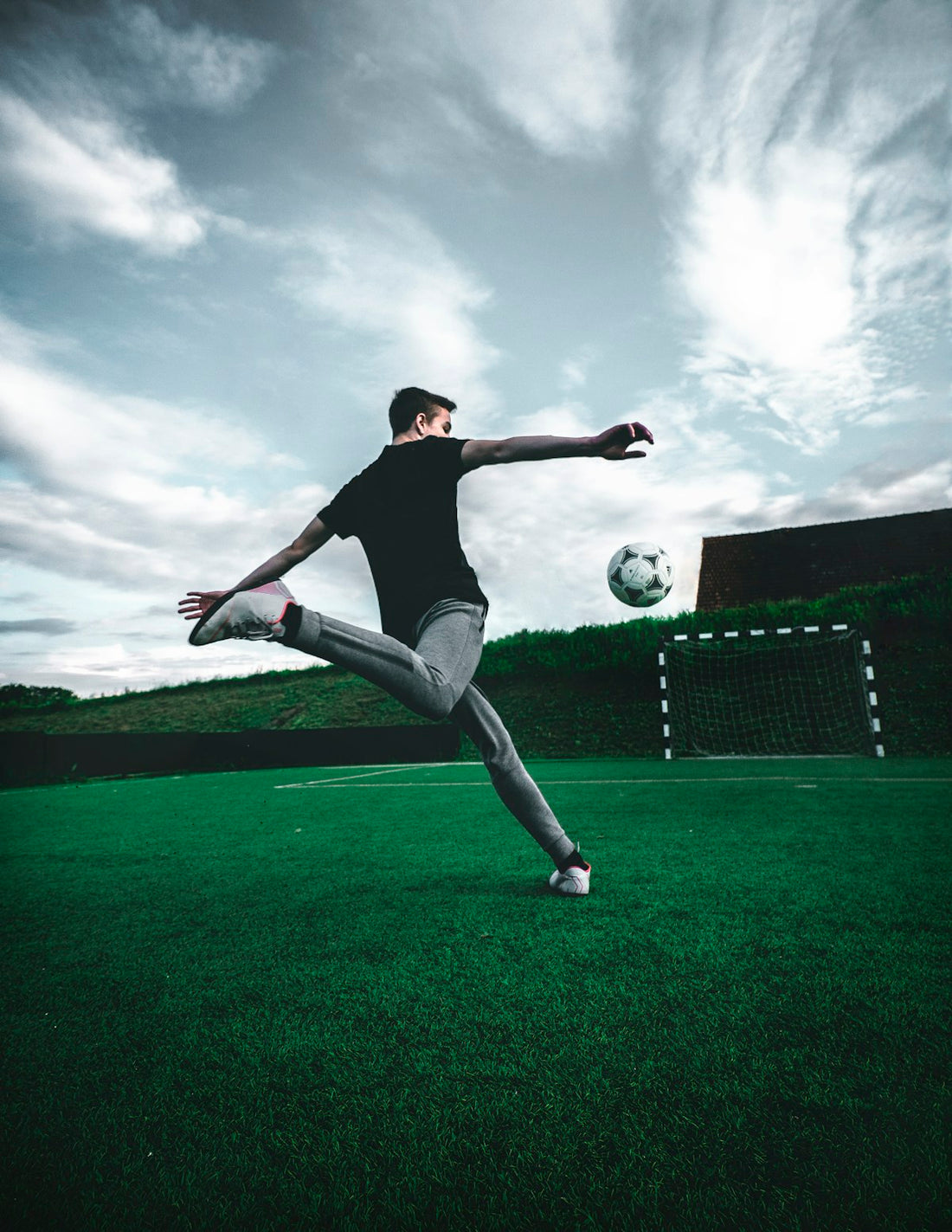 Youth soccer player dribbling with the ball